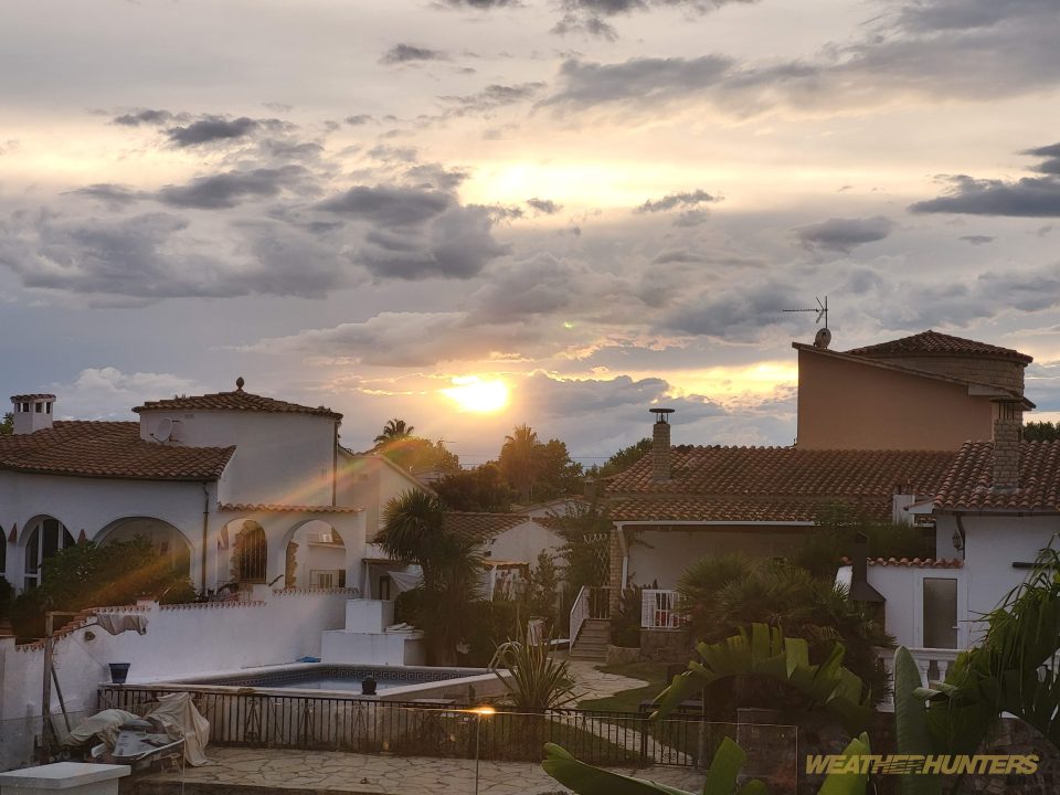 Sun breaking through clouds