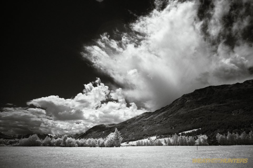 clouds against mountains